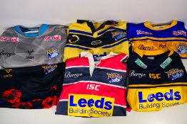 Six Leeds Rhinos replica shirts, sizes 2XL and 3XL.