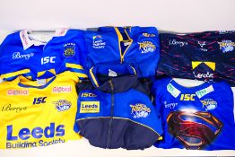 Six Leeds Rhinos replica shirts and tracksuit tops, sizes L, XL and XXL.