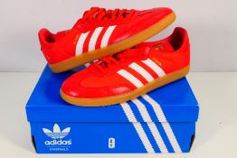 Adidas - A pair of Oyster Samba Og trainers in red, UK size 9½, contained in Adidas box.