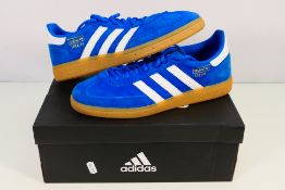 Adidas - A pair of Handball Spezial trainers in blue and white, UK size 9, contained in Adidas box.