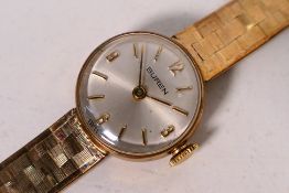 A lady's 9ct gold Buren bracelet wristwatch, 18.3 grams excluding movement.