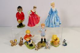 A group of ceramic figures to include three Royal Doulton, The Winnie The Pooh Collection figures,