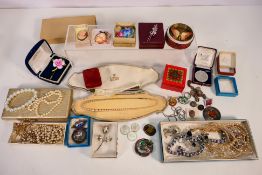 A collection of costume jewellery to include brooches, necklaces, bracelet and similar.