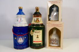 Four decanters of Bells whisky (with contents)