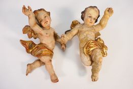 Painted putti with gilt wings and drapery