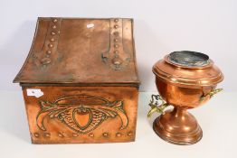 An Arts and Crafts style embossed copper coal scuttle and a copper and brass samovar.