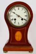 A mahogany inlaid balloon mantel clock,