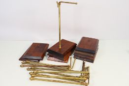 A collection of vintage brass and wood, adjustable, retail display stands,