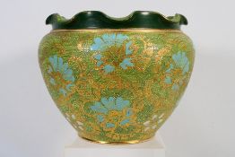 A Doulton Lambeth Chine ware jardiniere with shaped rim, decorated in green, blue and gilt,