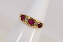 A yellow metal diamond and ruby ring, size approximately Q but shank misshapen, 2.