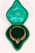 A rose metal (stamped 9ct) gate link bracelet and padlock clasp, approximately 16 cm (l) and 8.