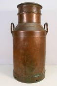 A copper twin handled milk churn bearing plaque marked Roelof Waninge 11
