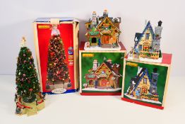 Lemax - Three boxed Christmas models comprising a Village Collection Lighted Musical Christmas Tree,