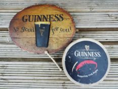 Breweriana - an oval Guinness advertising sign and A Bodhran with beater