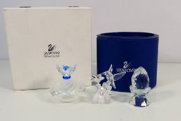 Swarovski - A boxed Hummingbird figure and a Swarovski Silver Crystal ring dish and cover contained