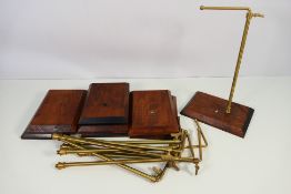 A collection of vintage brass and wood, adjustable, retail display stands,