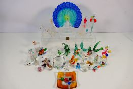 A collection of polychrome and clear glass figures to include fish, birds, clown and other.
