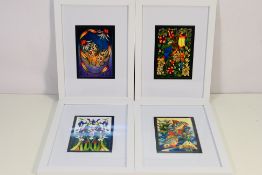 Moorcroft - four mounted and framed Moocroft prints depicting the following pottery patterns: Wild