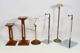 A collection of retail display stands to include a wig / hat stand