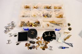 A collection of cufflinks to include novelty examples,