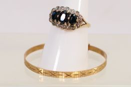A 9ct yellow gold stone set ring, stamped to the shank DIA, size O, approximately 2.