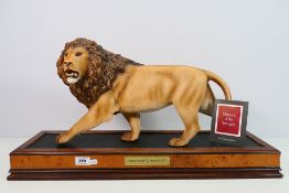 A Franklin Mint porcelain study depicting a male lion from the Big Cat series,