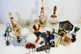 Lighting to include table lamps, wall mountable lantern, glass shades and other.