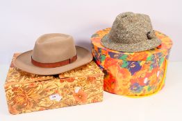 Two hats contained in boxes to include a Harris Tweed trilby by Dunn & Co, size 7⅛. [2].