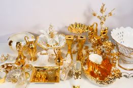A collection of white and gilt ceramics