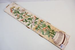 Five Victorian fireplace tiles depicting flowering peony, mounted to a board,