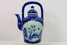 A Chinese blue and white wine pot and cover,