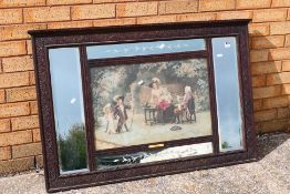 An over mantel mirrored panel with central print A Visit To Grandpa, approximately 76 cm x 117 cm.