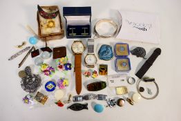 A quantity of costume jewellery to include a silver hinged bangle, stone set white metal bar brooch,
