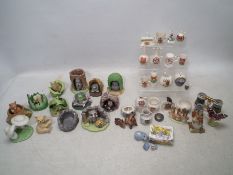 A collection of unboxed crested ware and hand painted porcelain figurines, lot to include.