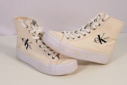 Calvin Klein - A pair of Calvin Klein platform high tops in cream, size 6.