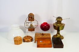 Lot to include a brass oil lamp with milk glass shade, a copper lantern, wooden boxes and other.