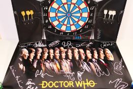 A Canaveral electronic dartboard and two sets of darts (in working condition) and a Dr Who poster