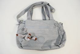 Kipling - A Kipling grey day bag with silver coloured detail, fully lined with internal pockets,