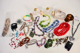 A quantity of costume jewellery comprising necklaces, earrings, brooches and other,