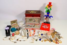 A collection of costume jewellery to include necklaces, brooches,