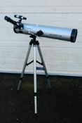 A Seben telescope with tripod.