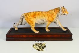 A Franklin Mint porcelain study depicting a Bengal tiger from the Big Cat series,