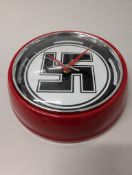 A novelty wall clock,