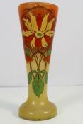 A glass vase with hand painted Art Nouveau style decoration, approximately 25 cm (h).