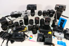 Photography - A collection of cameras and accessories to include Minolta, Olympus, Canon and other,