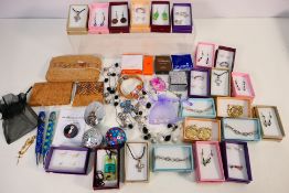 A collection of costume jewellery, largely individually boxed to include necklaces,