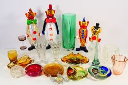 A quantity of decorative glassware to include Murano clown figures, vases, centrepieces and other,