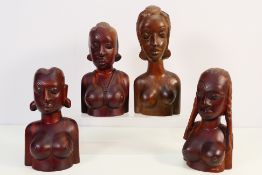 Four African carved wood busts of female figures, largest approximately 25 cm (h).