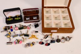A collection of cufflinks including novelty examples.