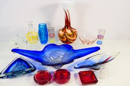 A collection of decorative art glass to include vases, bowls, centrepieces and similar,
